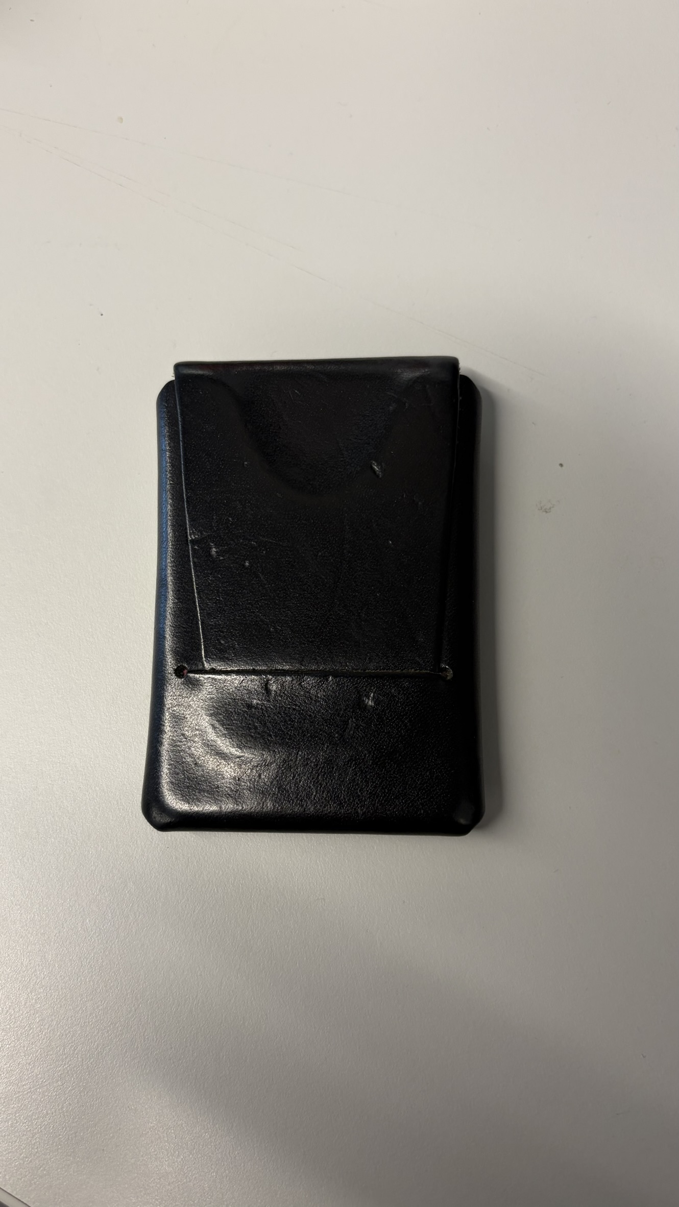 Black leather Firstfold wallet closed